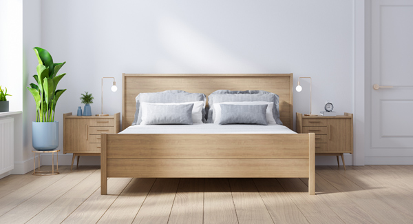 light wooden bed frame with matching bedside cabinets